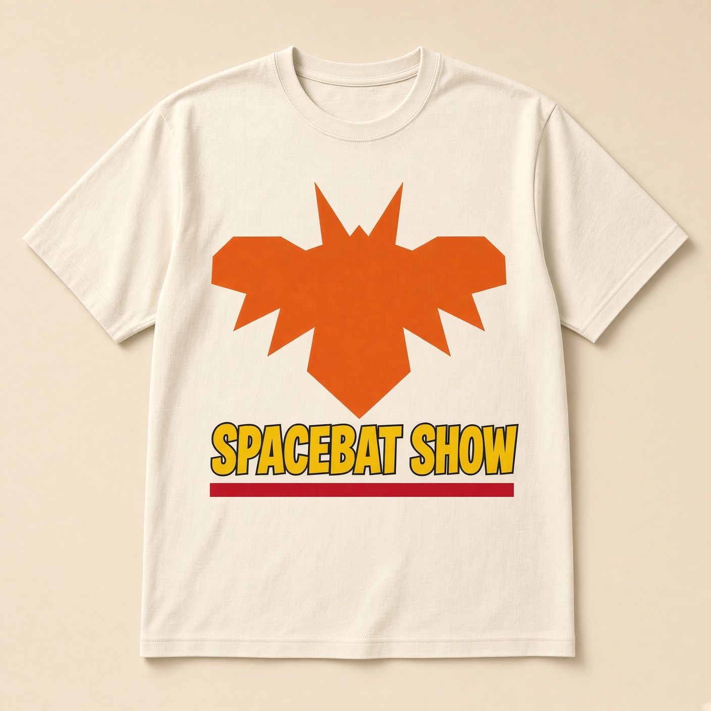 Cream t-shirt with the orange SpaceBat emblem and SPACEBAT SHOW in yellow comic letters.
